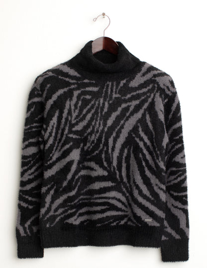Maglia dolcevita con fantasia jacquard animalier