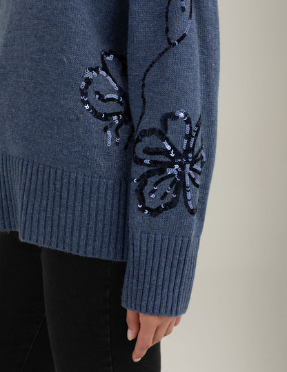 Maglia dolcevita con ricami floreali