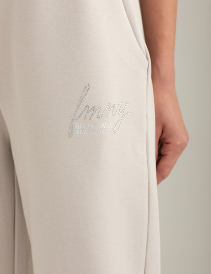 Pantalone interlock con dettagli strass